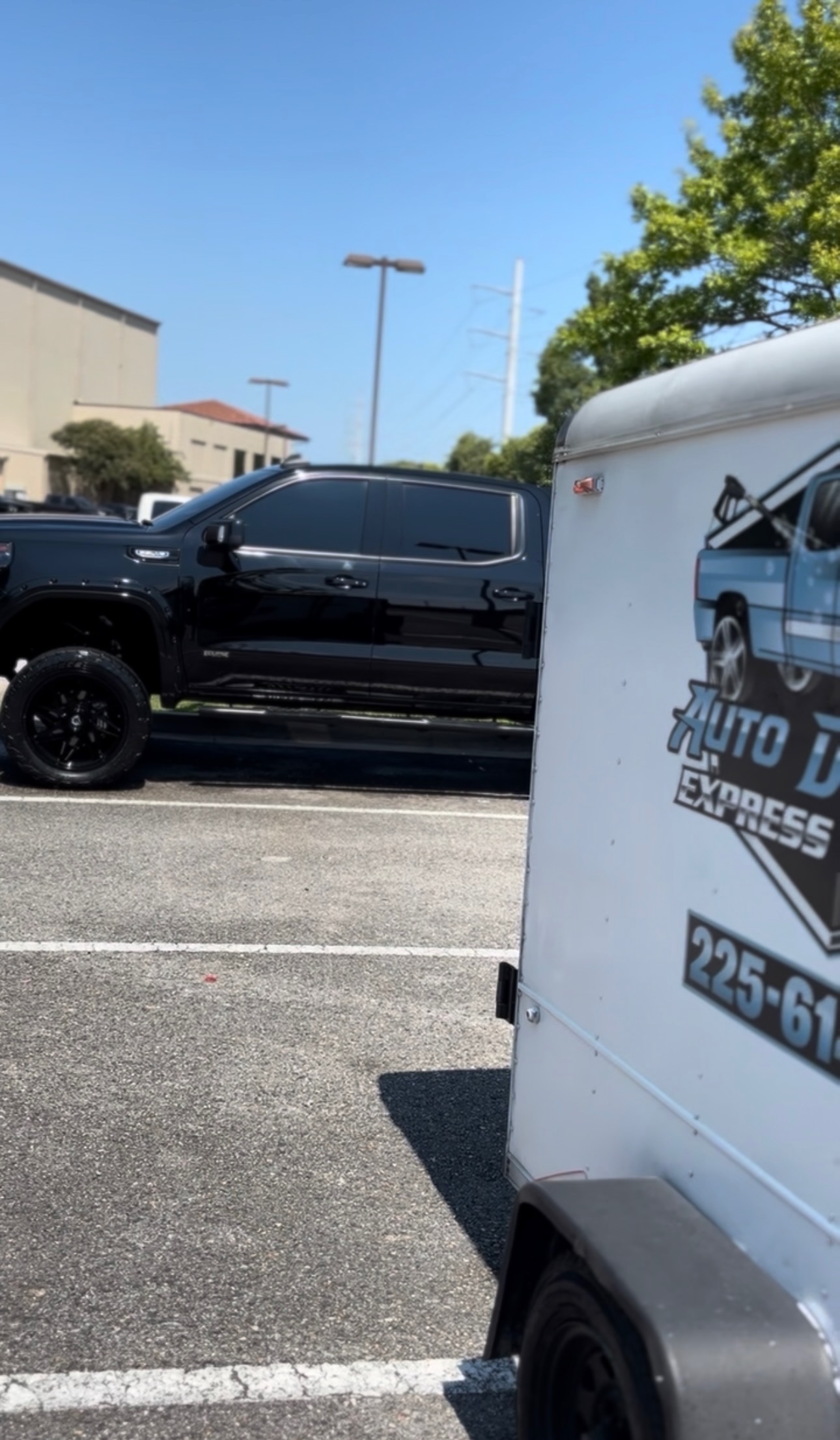 Glossy black vehicle after professional paint correction and swirl-mark removal in Baton Rouge