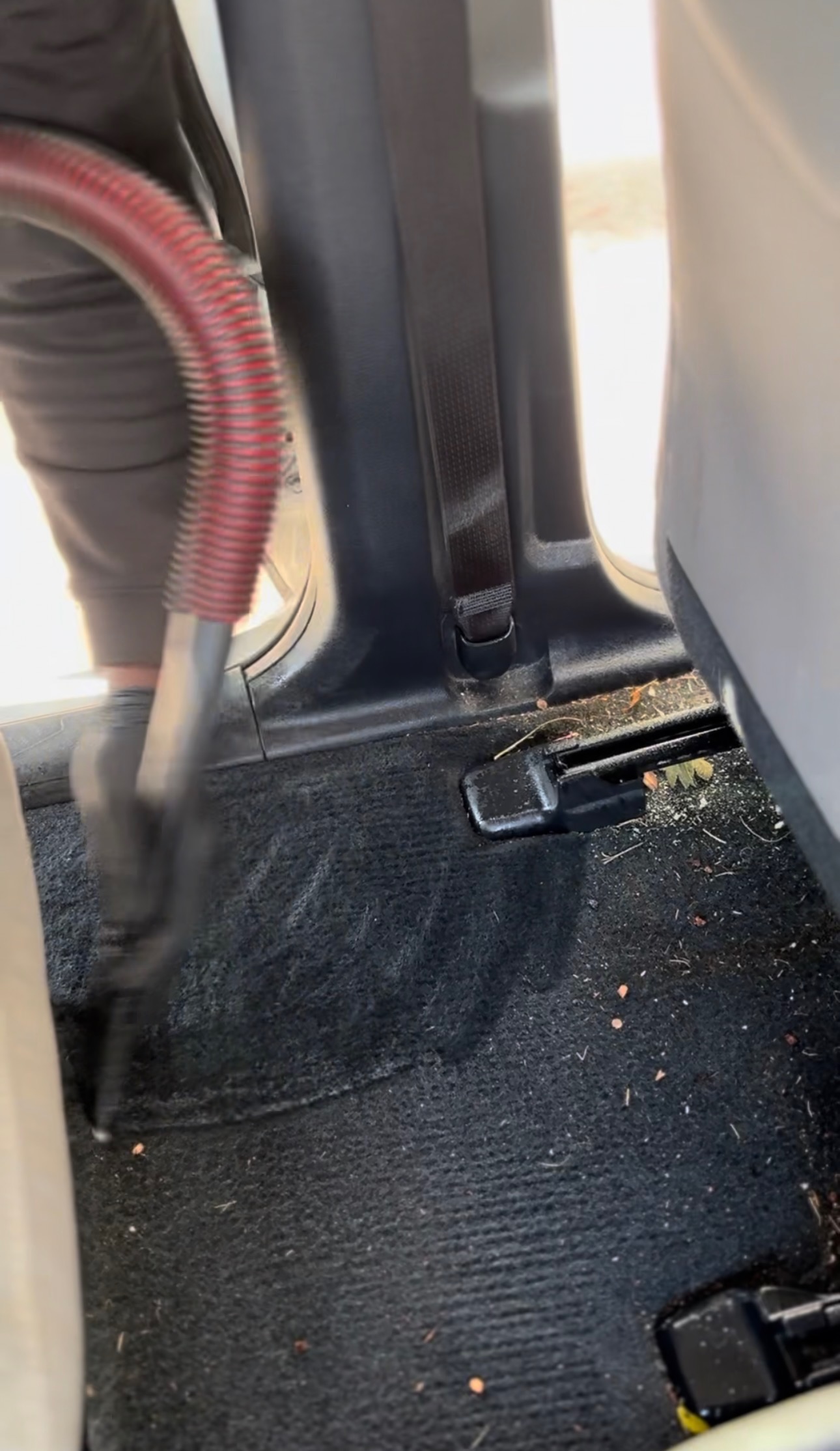 Deep vacuuming of car seats, carpets, and floor mats during mobile interior detailing in Baton Rouge, LA