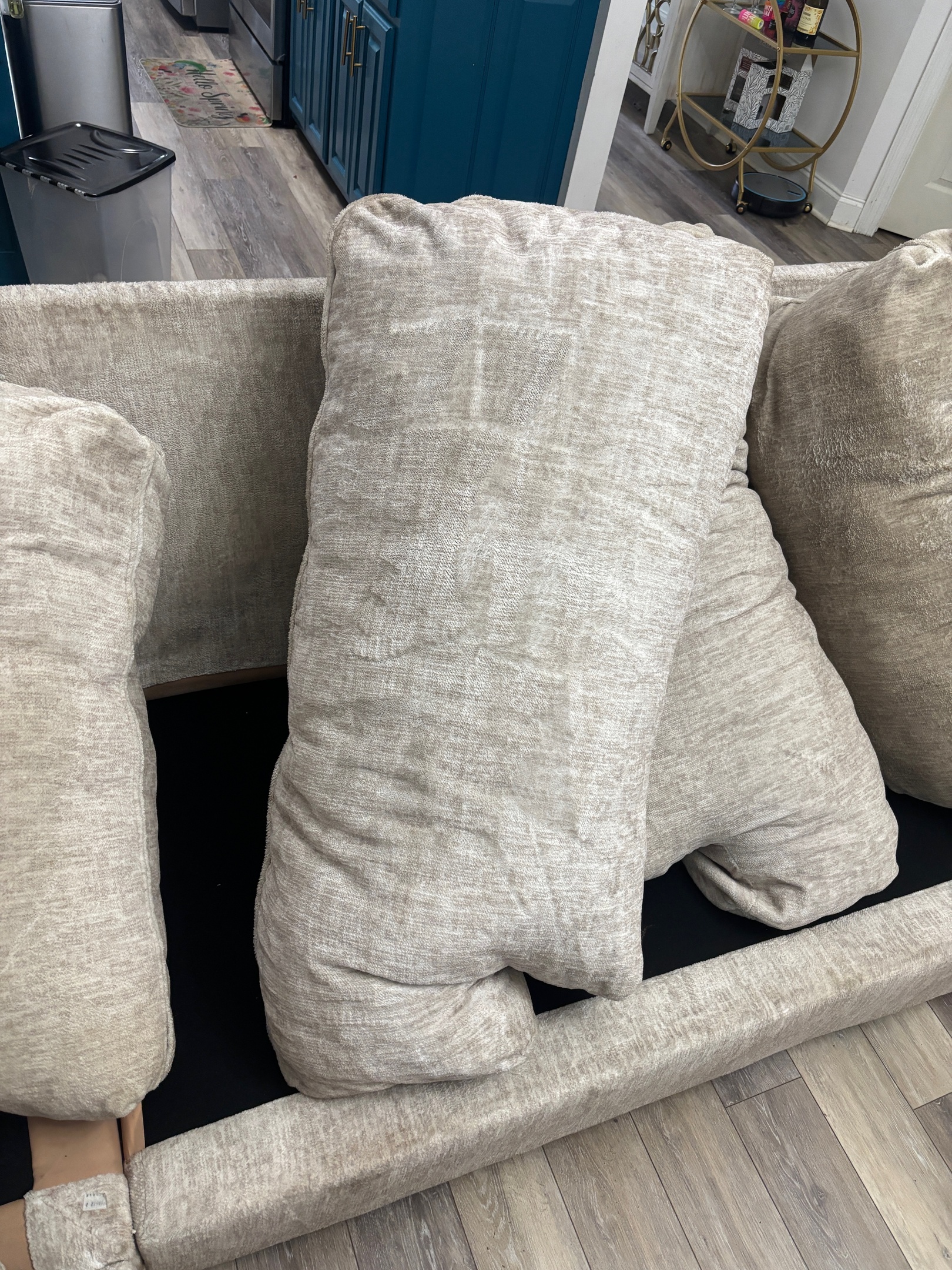 Freshly cleaned sofa cushions arranged upright to dry after upholstery extraction