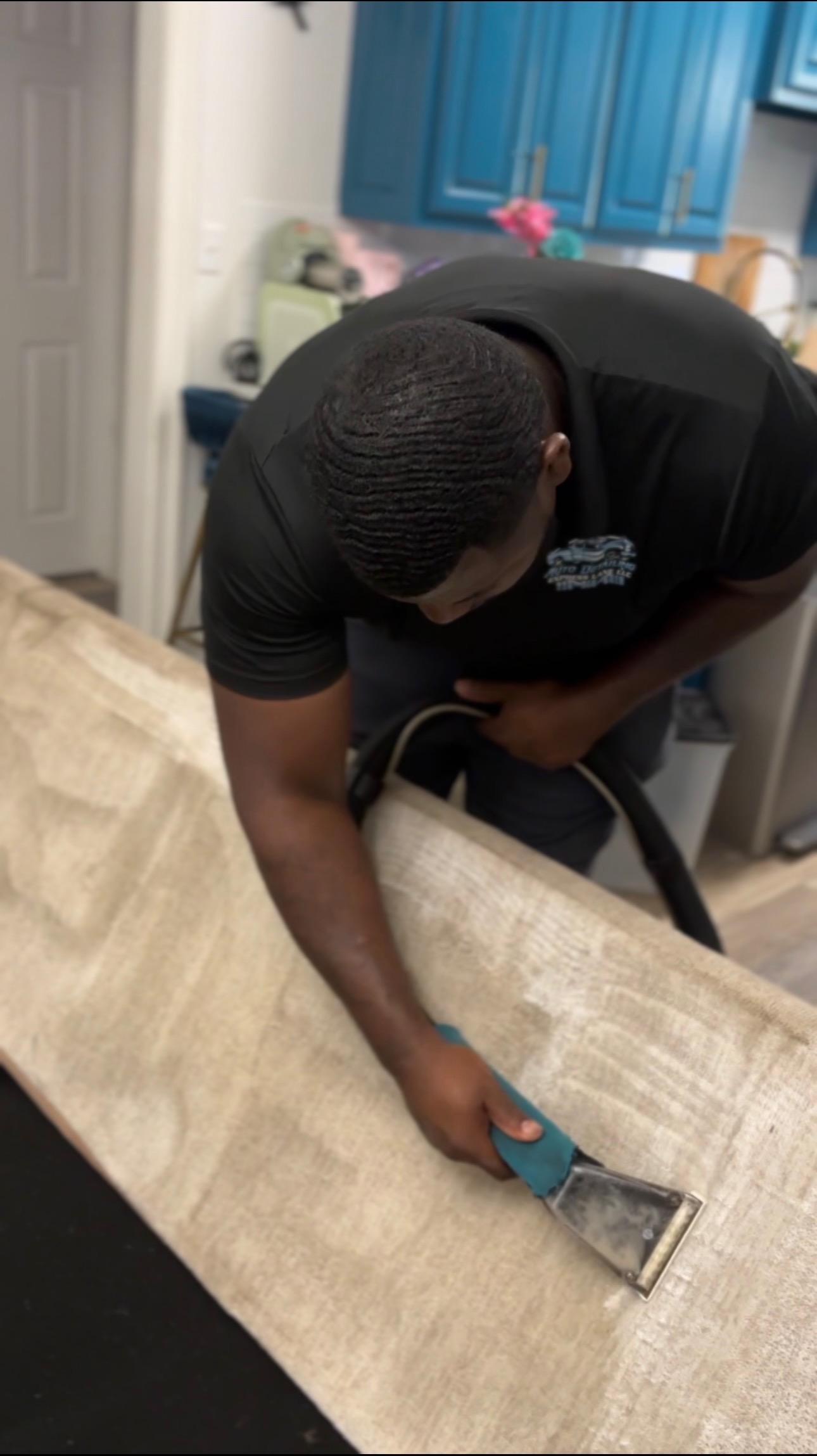 Technician deep cleaning a sofa during mobile furniture upholstery cleaning in Baton Rouge
