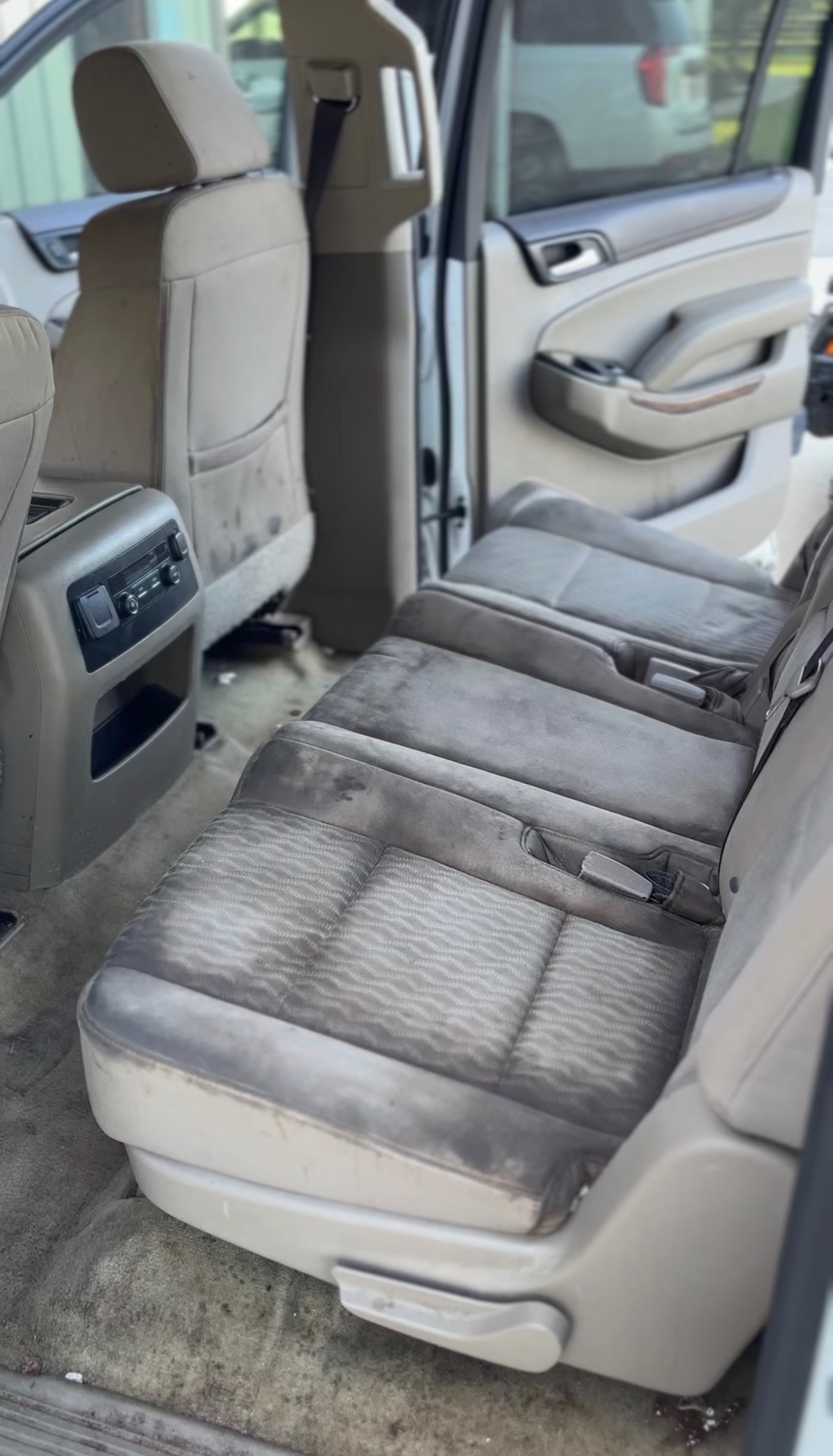Vehicle interior before professional deep cleaning and detailing