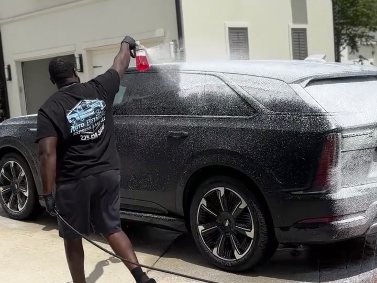 Auto Detailing Express Lane applying a foam pre-wash to a client’s vehicle in Baton Rouge, LA